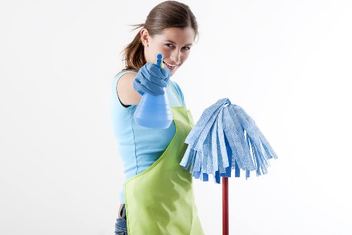 Carpet cleaning team with safety equipment in a home setting